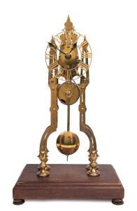 A brass skeleton clock with fusee movement, housed in late Perspex display case. Clock 42cm