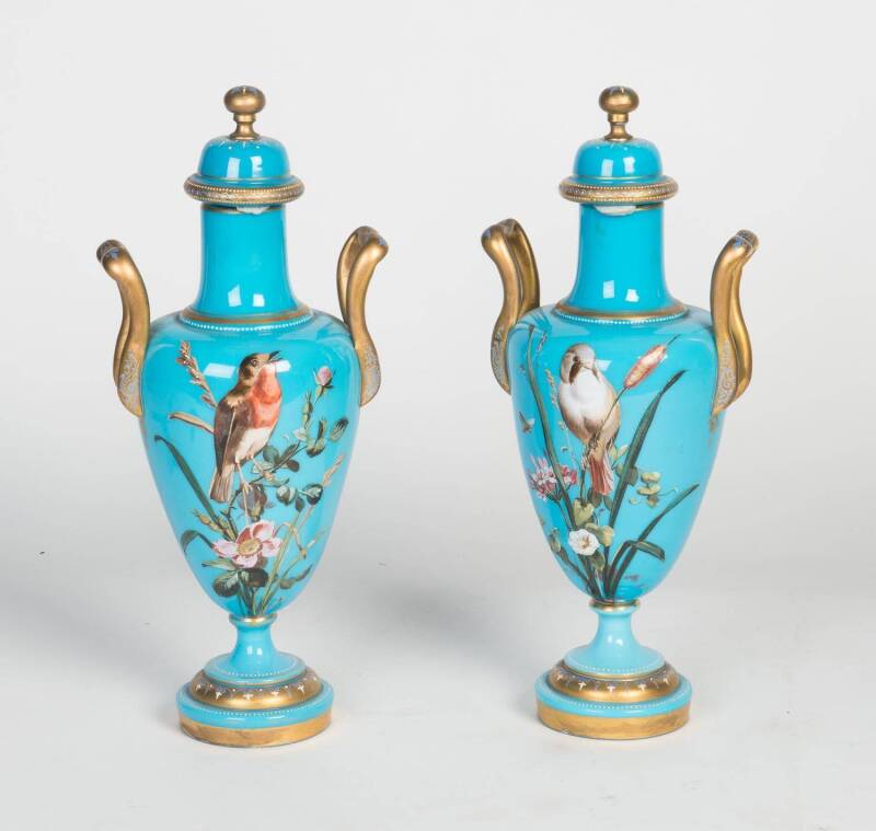 A pair of continental vases and covers, enamel decoration, probably French, 19th Century. Retailed by Bergna Bros, Sunderland, UK. Height 39cm