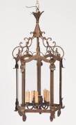 A wrought iron lantern style chandelier. 90cm high