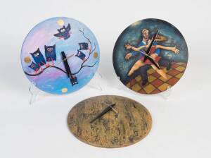 Three circular wall clocks painted by Australian artists, one "Owl at 12 O'Clock" by Syd Tunn, Creek House Studios. 35 cm diameter