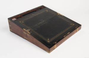 A Victorian mahogany brass bound writing slope, with hinged leather topped writing slope and ink compartments. 50cm high, 22cm wide, 20cm deep