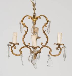 A pair of small gilt bronze and cut glass chandeliers in the Louis XV style. 35cm high, 35cm diameter