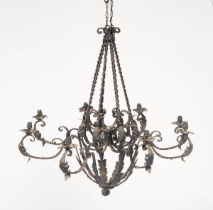 A French provincial style wrought iron chandelier with twist turned supports