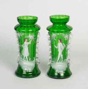 A pair of Mary Gregory style green glass enamelled vases together with a green glass lustre. The lustre 32cm