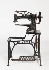 A Victorian Singer pedal sewing machine with the original cast iron stand. 114cm high, 72cm wide, 47cm deep.