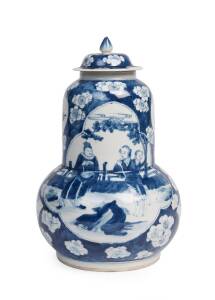 A Chinese blue and white gourd shaped vase and cover decorated with officials and ladies a garden, 19th Century. 33cm high