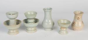 Three Qingbai candlesticks and two Qingbai vases. Vases: 12cm and 14.5cm high, candlesticks: 7.5cm-13.5cm highProvenance: The Dr. Steven Zador Collection.