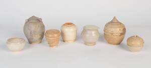 Three Chinese white glazed jars together with four South East Asian jars. 5cm-12cm high.Provenance: The Dr. Steven Zador Collection.