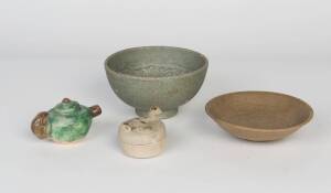 A Chinese celadon dish with carved lotus decorated interior, 13th Century, 15.6cm diameter; together with a green glazed waterdrop, 6cm high; and a celadon glazed bowl, 16.5cm diameter.Provenance: The Dr. Steven Zador Collection.