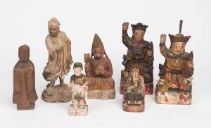 Four lacquered wood carved Daoist figures and one wood carved Daoist figure, together with one coloured carved wood Tibetan figure of a monk and one wood carved female figure, 20th Century. 14cm-20cm high.Provenance: The Dr. Steven Zador Collection.