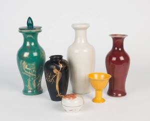 Three porcelain vases together with one yellow glazed cup, a covered box and a black vase, 20th century. 5cm-29cm high