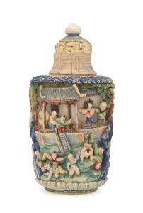 A Chinese carved and coloured ivory snuff bottle, 20th Century. 11cm high. &diams;