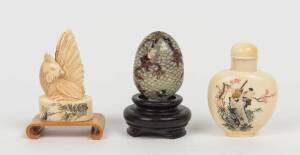 A Japanese snuff bottle, 6cm high; together with a Chinese carved ivory chicken seal, 6cm high and a Japanese glass cloisonne egg shaped object, 4cm high; 20th Century. &diams;&nbsp;