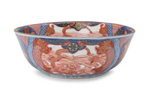 A large Japanese imari bowl with dragon and phoenix design, 19th Century. 31cm diameter