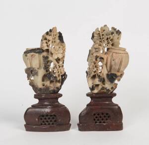 A pair of Chinese carved soapstone vases on carved stone stands, 20th Century. 20cm