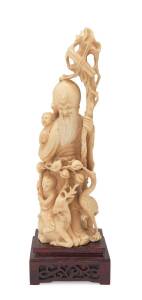 A Chinese carved ivory figure group on wooden stand, early to mid 20th Century. Ivory 22.5cm. &diams;