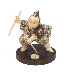 A Japanese carved ivory figure of a Samurai on timber base, 20th Century. 11cm. &diams;