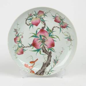 A Chinese famile-rose porcelain plate, 20th Century, with peach and pine tree decoration, "Guang Xu" mark to the base, 36cm diameter.