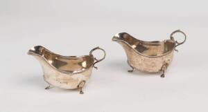 A George V sterling silver cruet set & pair of sauce boats
