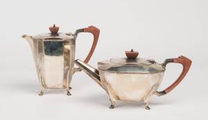 An Art Deco sterling silver tea pot and coffee pot by Cooper Brothers & Sons, Sheffield 1946. 13cm & 19cm high, 1440 grams total weight