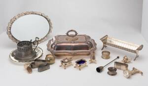 A collection of silver plated objects including vegetable tureen and cover, napkin rings, wine pours, candle snuffer, condiments, mirrors etc.&nbsp;