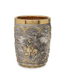 A silver beaker with gilt decoration and interior finish, stamped "925". 11cm high, 330 grams