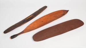 An Aboriginal woomera from Ernaballa (91cm) and 2 shields from Amata South Australia (73cm) and Hooker Creek Northern Territory (67cm)