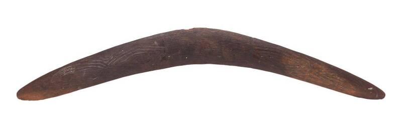 An Early Incised Boomerang, New South Wales origin, carved hardwood, 19th Century. 65 cm longPROVENANCE: Surveyor operating in Southern Queensland (collected late 19th century). By descent. Private Collection, United Kingdom