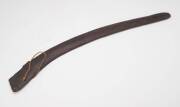 A Hooked Boomerang, Northern Territory (19th Century), carved hardwood and rope, 63.5 cm long 