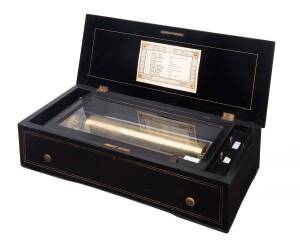 BREMOND 13" cylinder music box in walnut case, playing 12 tunes with tune sheet, dated 1875.