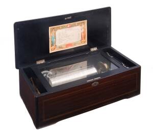 P.V.F St Croix 9" cylinder music box in walnut case, Swiss made, plays 12 tunes. 18cm high, 54cm wide, 25cm deep. Together with tune sheet.