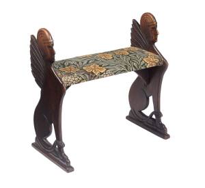 An Australian pine sphinx carved piano stool.&nbsp;69cm high, 66cm wide, 30cm deep