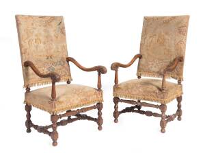 A pair of Louis XIV tapestry upholstered carver chairs