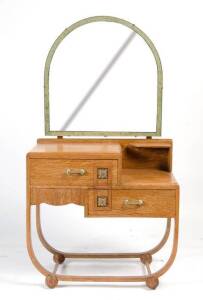 A small Art Deco oak dressing table with bakelite mounts.&nbsp;147cm high, 79cm wide, 41cm deep