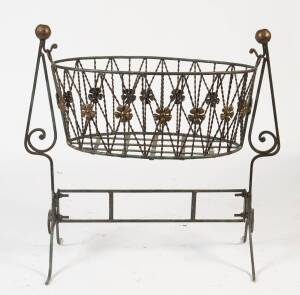 A wrought iron bassinet on stand. 100cm high, 95cm wide, 54cm deep