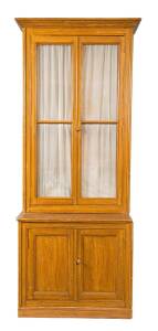 A simulated pine glazed bookcase, French, 19th century and later