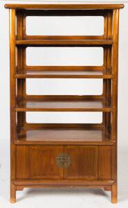 A Chinese&nbsp;free standing open elm wood bookshelf above an enclosed cabinet186cm high, 100cm wide, 46cm deep