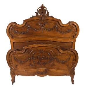 A French carved walnut bed, 19th Century with custom made mattress and base. 175cm high, &nbsp;154cm wide