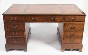 A reproduction twin pedestal&nbsp;mahogany desk with brown leather inset top. 79cm&nbsp;high, 152cm wide, 92cm deep. together with a brown leather button back revolving office chair.&nbsp;