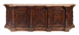 A walnut sideboard with applied ribbed decoration to the door panels, French, 18th/19th Century. 82cm high, 250cm wide, 50cm deep