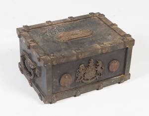 A small cast iron chest with central crest