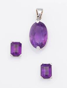 An amethyst suite comprising a pendant and pair of earrings. 18ct white gold and silver. Total weight 9.97 grams. Length of pendant 28mm.