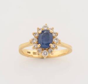 A sapphire and diamond cluster ring. 18ct yellow gold. Weight 3.18 grams. Size H.&nbsp;