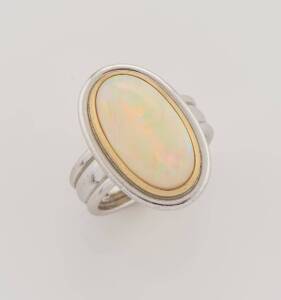 A solid white opal dress ring. 18ct white gold. Weight 9.36 grams. Size L.&nbsp;
