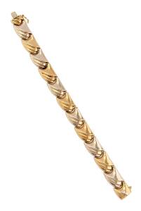 A two-tone gold bracelet. 18ct yellow and white gold. Weight 26.65 grams. Length 19cm.