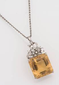 A citrine and diamond pendant. White metal. Weight 20.65 grams. Length of chain 44cm. Length of pendant 4cm.&nbsp;