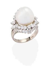 A South Sea pearl and diamond cocktail ring, the central 14.7mm drop shaped pearl surrounded by 48 round brilliant, baguette and marquise diamonds, of estimated total weight 2.4 carats. 18ct white gold. Weight 14.91 grams. Ring size T. 