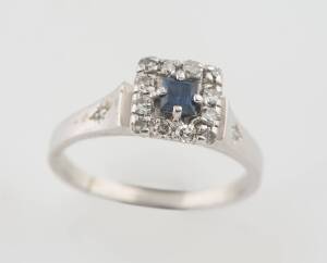 A sapphire and diamond ring, of square cluster design. 18ct white gold. Weight 4.95 grams. Size O ½. To be sold with a pearl and diamond tie tack.