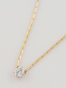 A 0.60 carat diamond pendant on chain, estimated diamond weight. 18ct yellow gold. Weight 3.63 grams. Length 40cm.