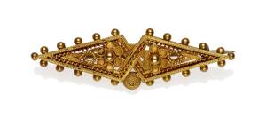 A gold Victorian brooch, Etruscan revival style. 15ct yellow gold. Weight 4.15 grams. Length 4.5cm.